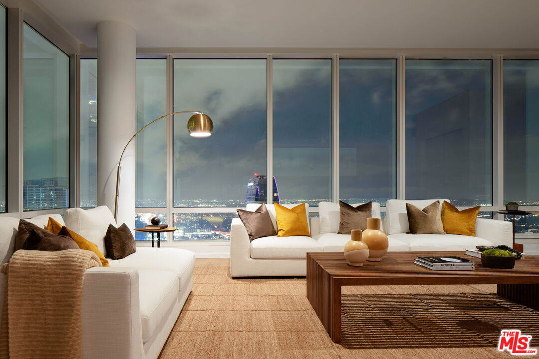 1000 West 8th Street, Unit PH5805 Los Angeles, CA 90017 - Photo 3 of 56 a living room with furniture and a lamp