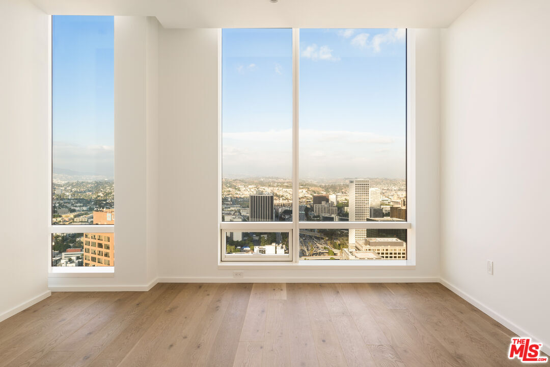 1000 West 8th Street, Unit PH5805 Los Angeles, CA 90017 - Photo 6 of 56 a view of a room with wooden floor and window