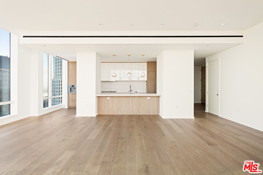 1000 West 8th Street, Unit PH5805 Los Angeles, CA 90017 - Photo 7 of 56 a view of a kitchen with a sink and a refrigerator