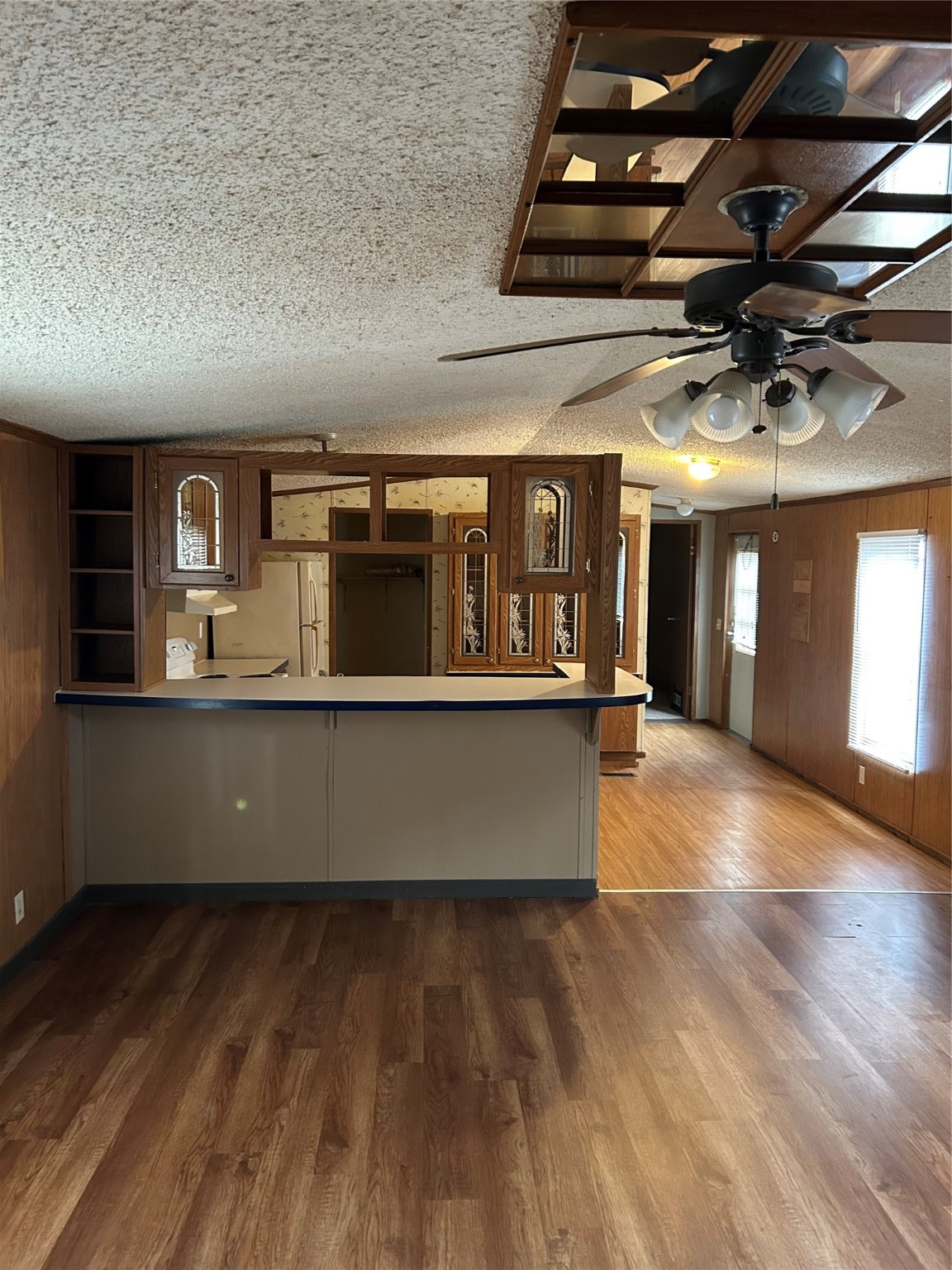 26163 Etta Road, Unit 7 Splendora, TX 77372 - Photo 1 of 10 a view of kitchen with stainless steel appliances granite countertop a dishwasher a stove top oven a dining table and chairs with wooden floor