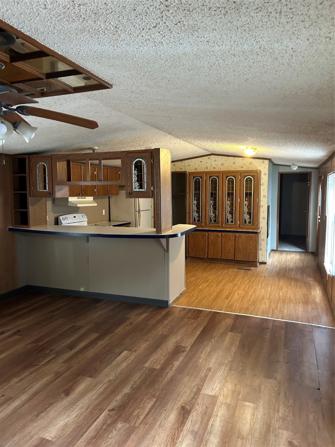26163 Etta Road, Unit 7 Splendora, TX 77372 - Photo 4 of 10 a view of a house with a barbeque and wooden floor