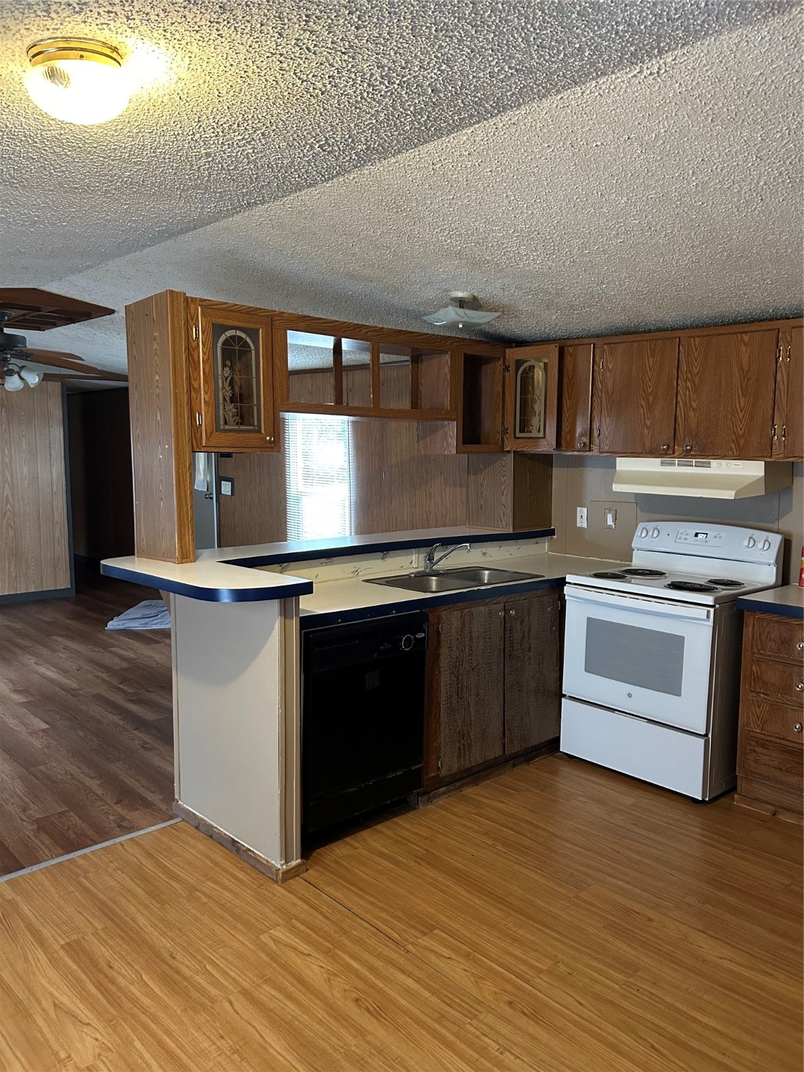 26163 Etta Road, Unit 7 Splendora, TX 77372 - Photo 5 of 10 a kitchen with stainless steel appliances granite countertop a stove and a sink