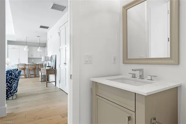 a en suite bathroom with a sink and a mirror