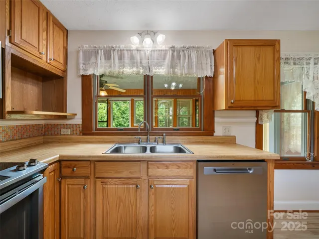 a kitchen with a sink and a window
