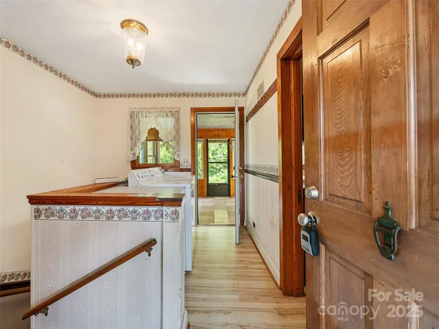 a view of a livingroom with furniture hardwood floor and a ceiling fan