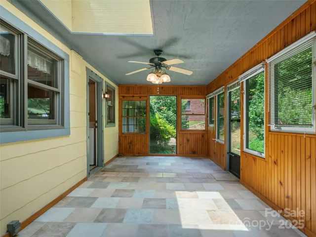 a view of a porch with a floor to ceiling windows