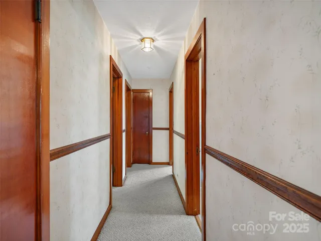 a view of a hallway with closet and entryway