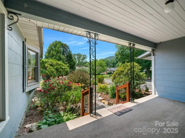 a couple of potted plants in front of door
