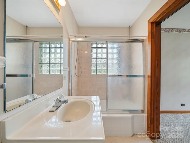 a bathroom with a tub and a sink