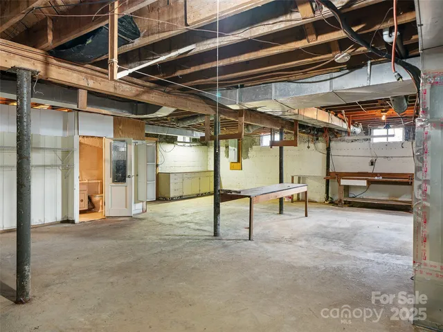 a view of empty room with wooden ceiling