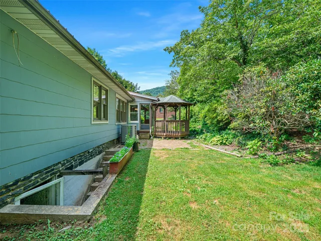 a front view of a house with yard