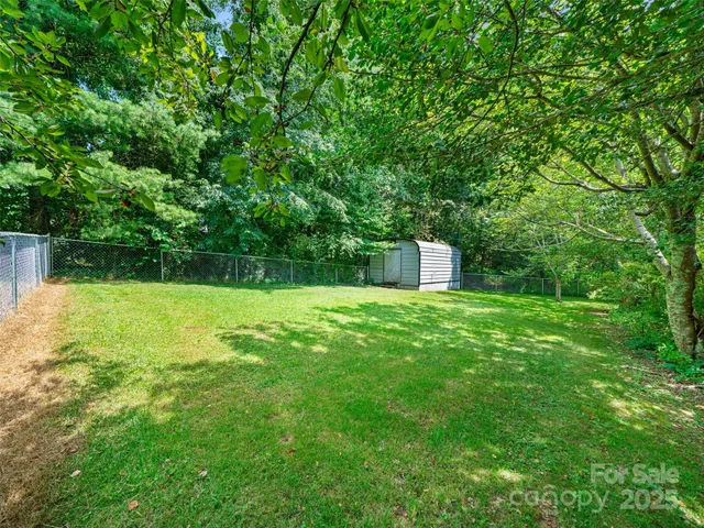 a backyard of a house with lots of green space