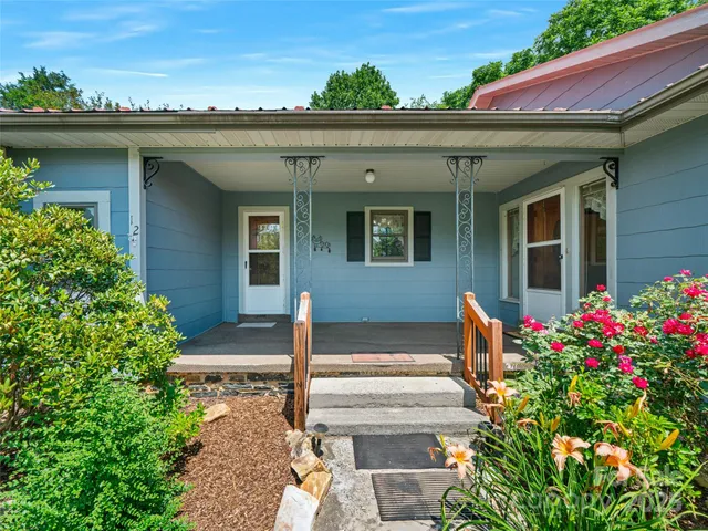 a front view of a house with a porch