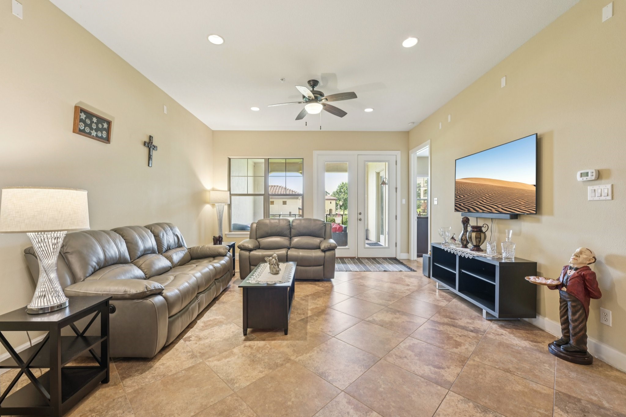 17040 West Fm 1097 Road, Unit 6103 Montgomery, TX 77356 - Photo 4 of 34 a living room with furniture and a flat screen tv