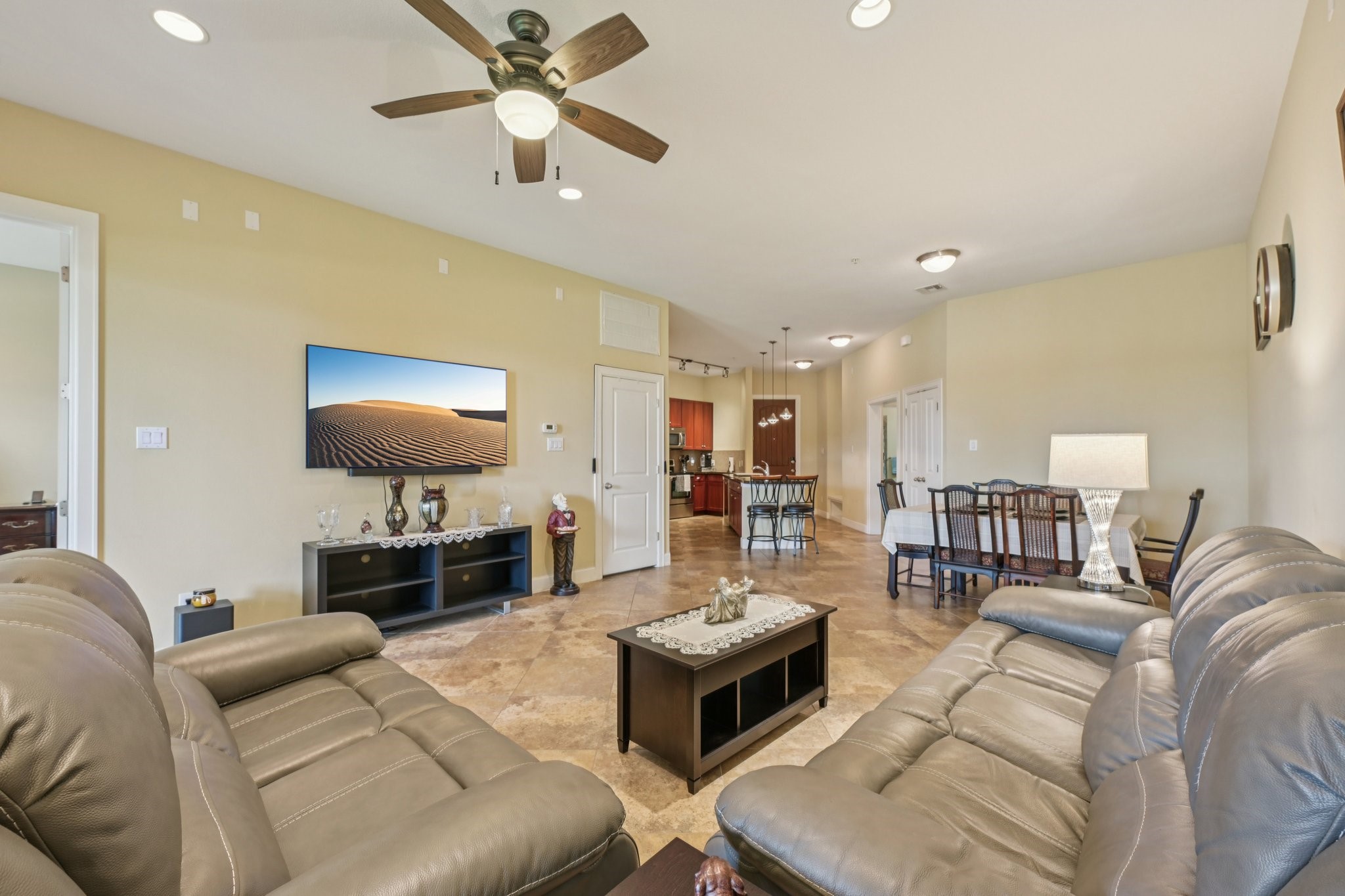 17040 West Fm 1097 Road, Unit 6103 Montgomery, TX 77356 - Photo 5 of 34 a living room with furniture and a flat screen tv