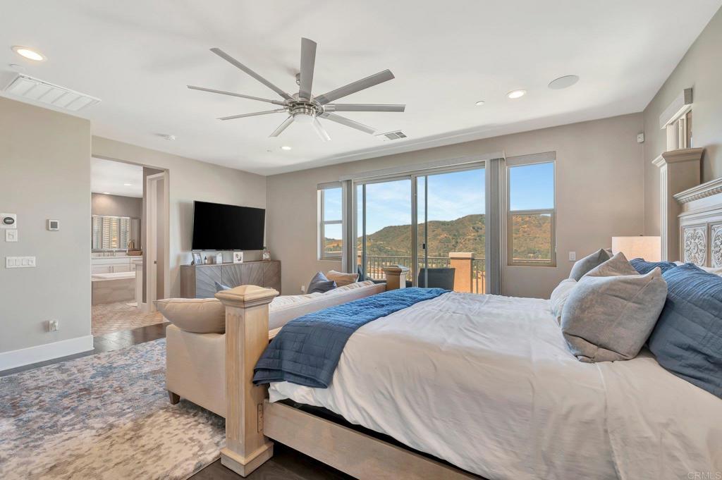 35822 Blue Breton Drive Fallbrook, CA 92028 - Photo 21 of 47 a bedroom with a bed and a flat screen tv