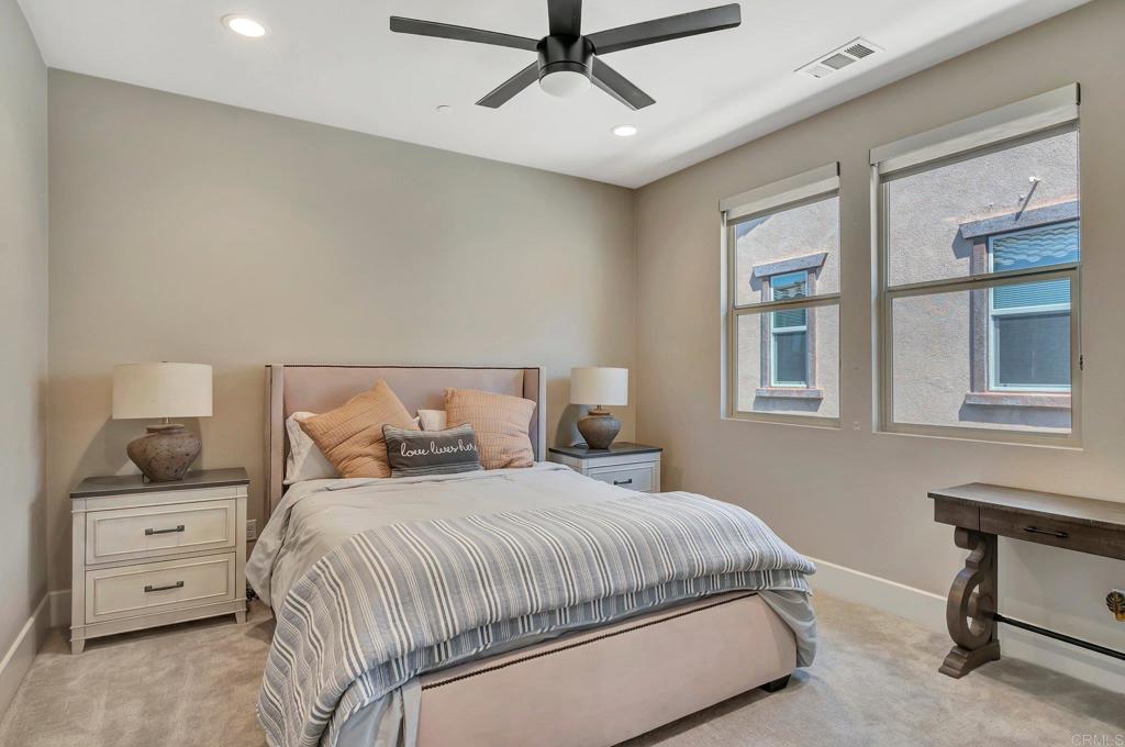 35822 Blue Breton Drive Fallbrook, CA 92028 - Photo 22 of 47 a bedroom with a bed a table and chair