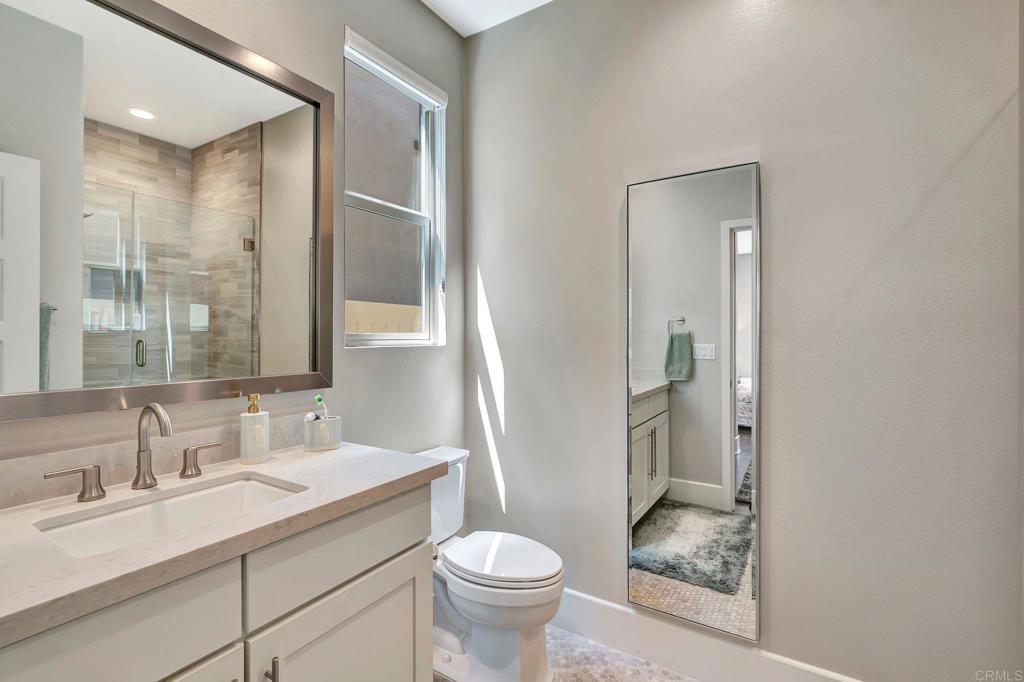 35822 Blue Breton Drive Fallbrook, CA 92028 - Photo 30 of 47 a bathroom with a granite countertop sink toilet and shower