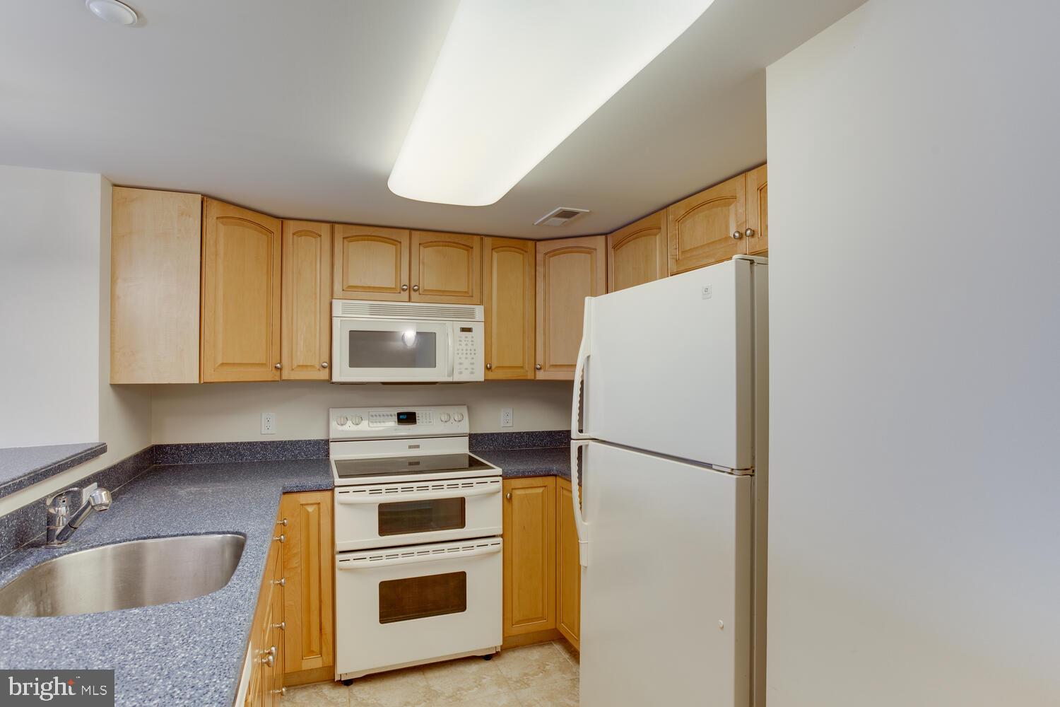 8501 Bayside Road, Unit 408 Chesapeake Beach, MD 20732 - Photo 10 of 34 Maple cabinets.