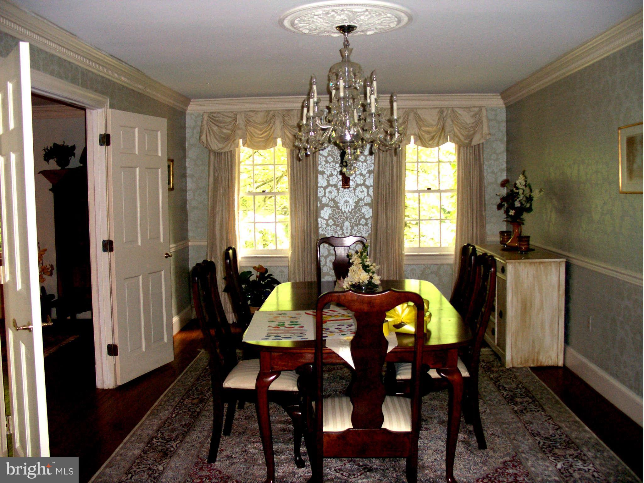 1304 Skipwith Road McLean, VA 22101 - Photo 13 of 25 a view of a dining room with furniture and chandelier