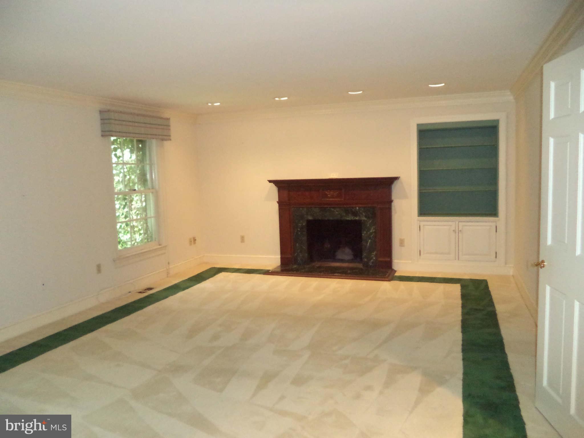 1304 Skipwith Road McLean, VA 22101 - Photo 15 of 25 an empty room with windows and fireplace