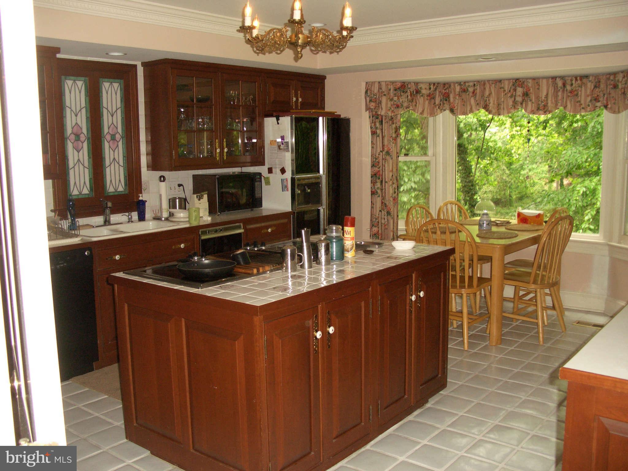 1304 Skipwith Road McLean, VA 22101 - Photo 10 of 25 a dining table chair next to a large window