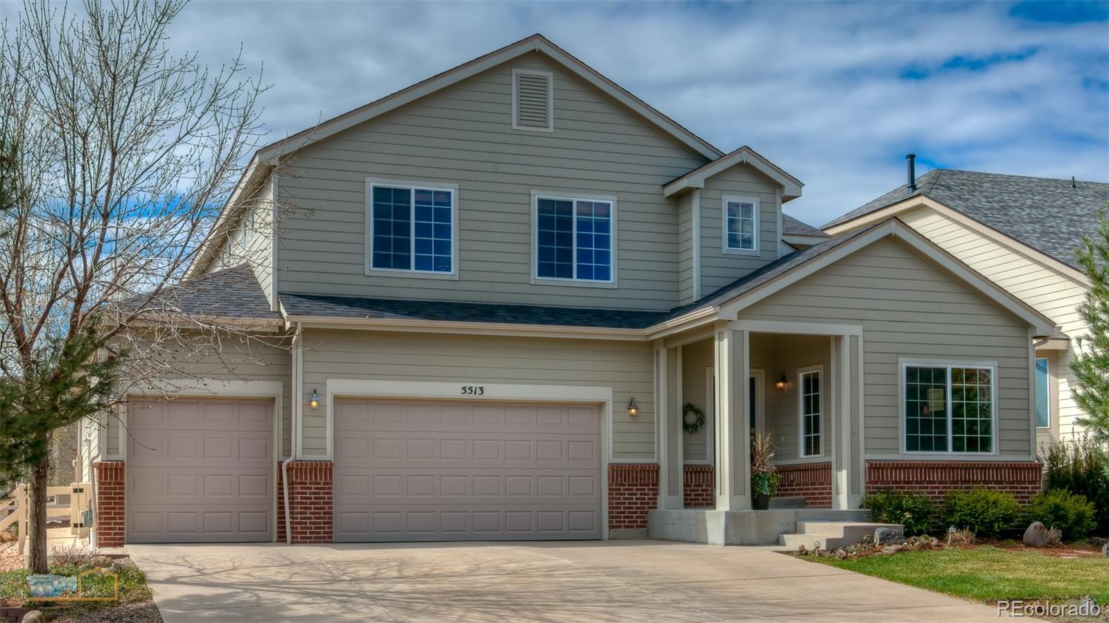 5513 Triple Crown Drive Frederick, CO 80504 - Photo 2 of 33 a view of a house with a yard
