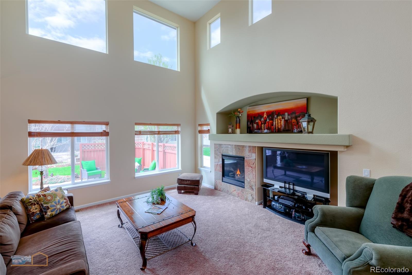 5513 Triple Crown Drive Frederick, CO 80504 - Photo 4 of 33 a living room with furniture and a fireplace