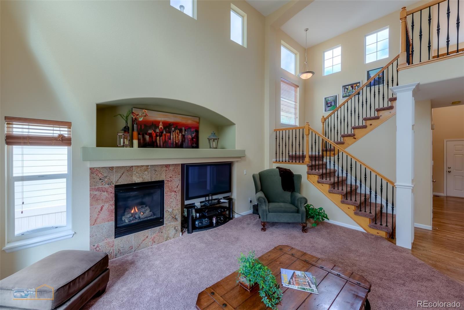 5513 Triple Crown Drive Frederick, CO 80504 - Photo 5 of 33 a living room with furniture and a fireplace
