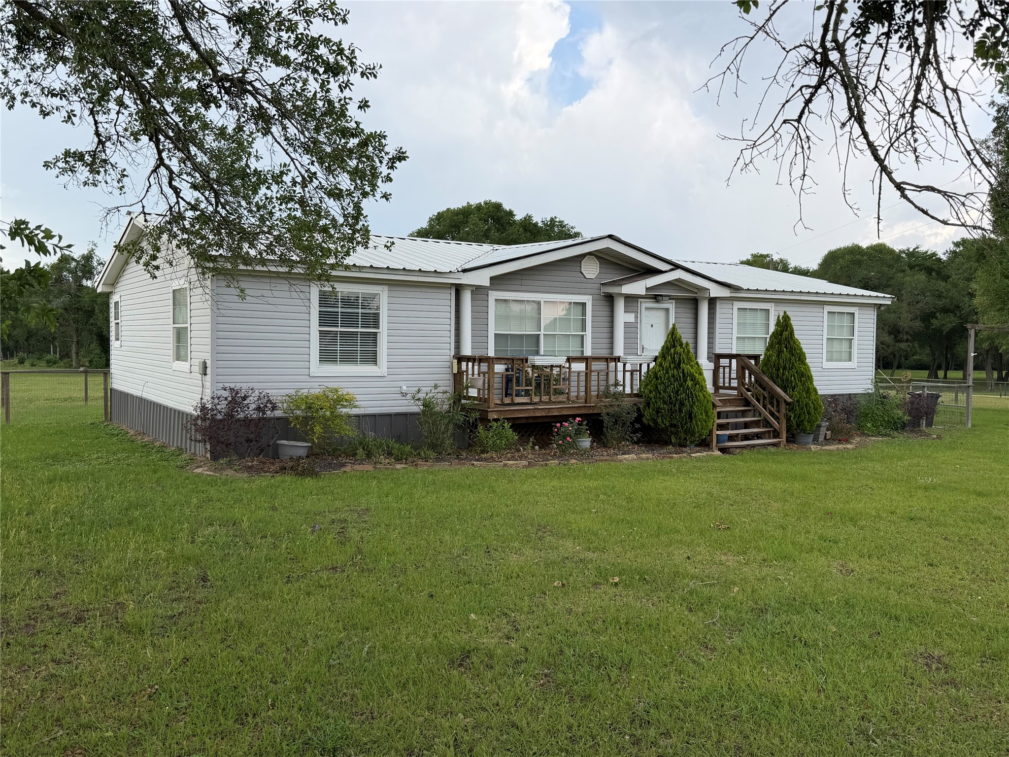 29480 Skymac Ranch Road Hempstead, TX 77445 - Photo 2 of 11 a view of a house with a backyard