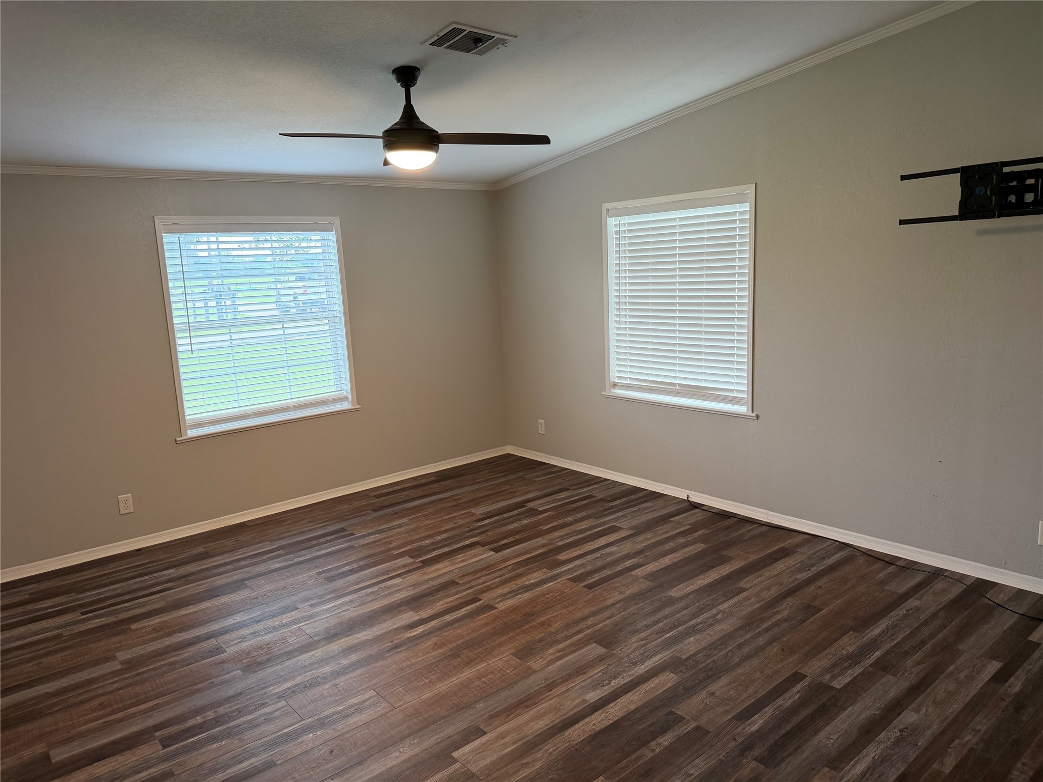 29480 Skymac Ranch Road Hempstead, TX 77445 - Photo 10 of 11 a view of an empty room with wooden floor and a window