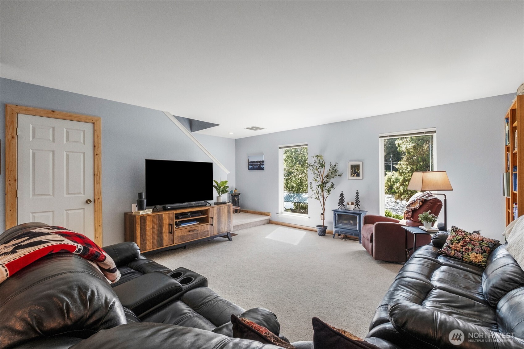 8348 Main Street, Unit 1 Peshastin, WA 98847 - Photo 7 of 40 a living room with furniture and a flat screen tv