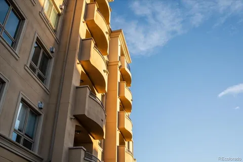 a front view of a building with potted plants