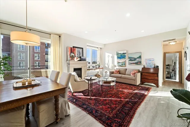 a living room with furniture wooden floor and a table