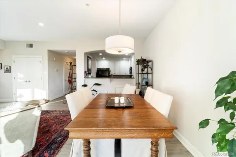 a large kitchen with a table and chairs