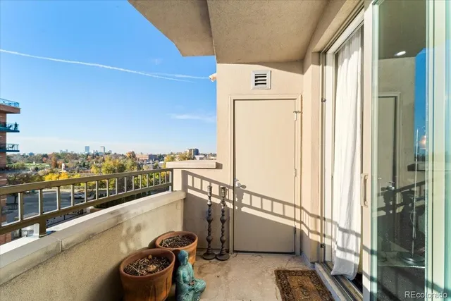 a view of a balcony with city view