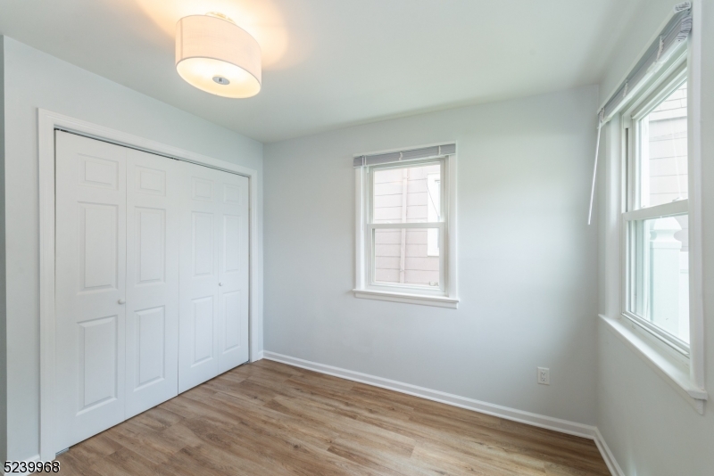 68 Orchard Street, Unit 1 Summit, NJ 07901 - Photo 11 of 23 an empty room with windows