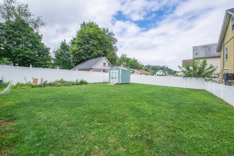 68 Orchard Street, Unit 1 Summit, NJ 07901 - Photo 20 of 23 a house view with garden space and trees