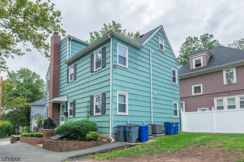 68 Orchard Street, Unit 1 Summit, NJ 07901 - Photo 22 of 23 a front view of house with yard and green space