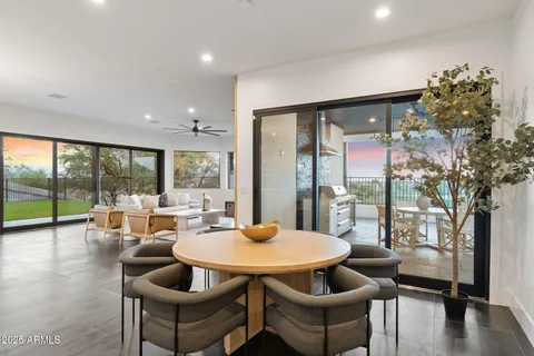 a outdoor space with patio the couches and a dining table with garden view