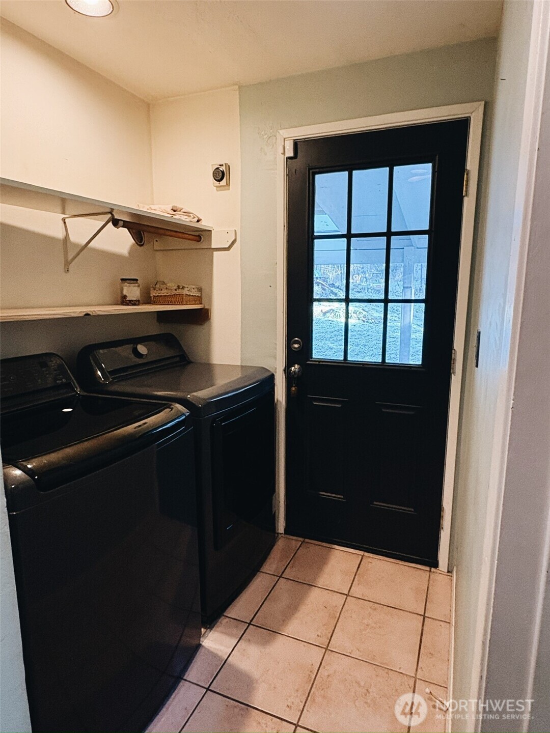 3257 East Harbor Road Langley, WA 98260 - Photo 14 of 20 a kitchen with a refrigerator and a stove