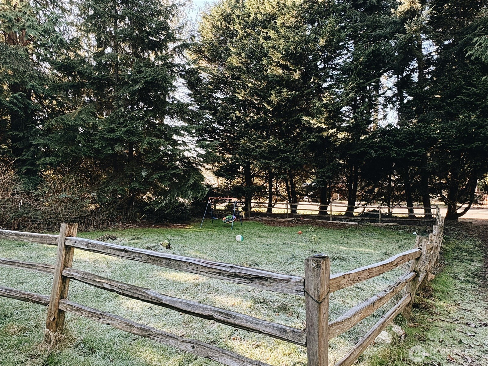 3257 East Harbor Road Langley, WA 98260 - Photo 19 of 20 a view of a yard with wooden fence