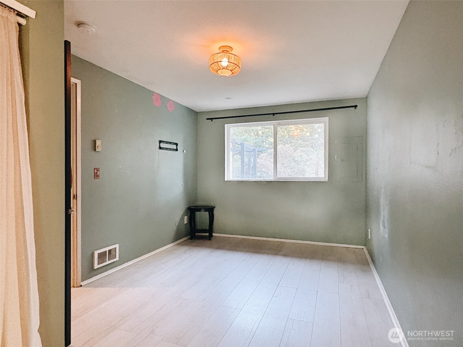 3257 East Harbor Road Langley, WA 98260 - Photo 7 of 20 a view of an empty room with window and closet area