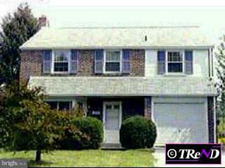 1735 Ridgeway Road Havertown, PA 19083 - Photo 1 of 1 a view of a brick building with potted plants and large windows
