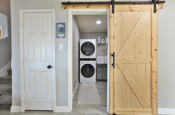 a view of a hallway with washer and dryer