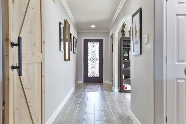 a view of a workspace with furniture window and wooden floor