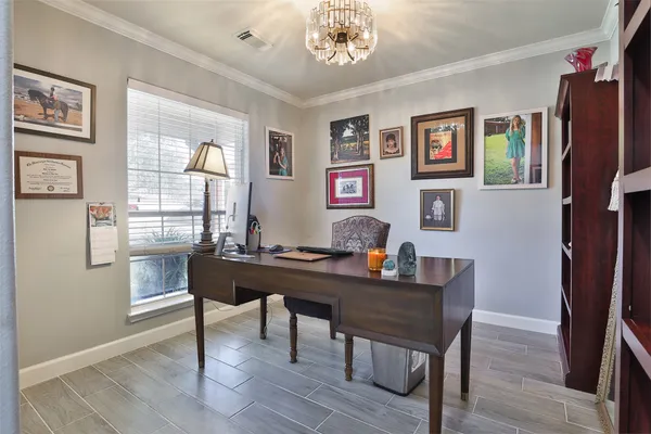 a living room with furniture cabinets and a window