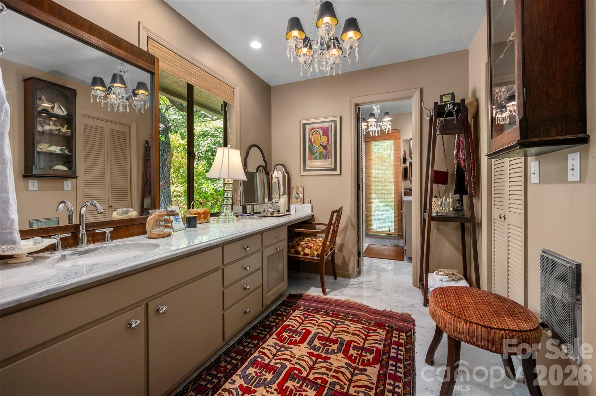 484 Sourwood Ridge Road Tryon, NC 28782 - Photo 20 of 34 a spacious bathroom with a double vanity sink and a mirror