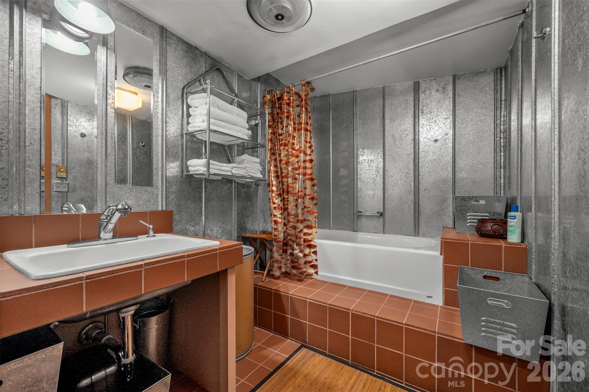 484 Sourwood Ridge Road Tryon, NC 28782 - Photo 25 of 34 a bathroom with a bathtub a sink and a shower