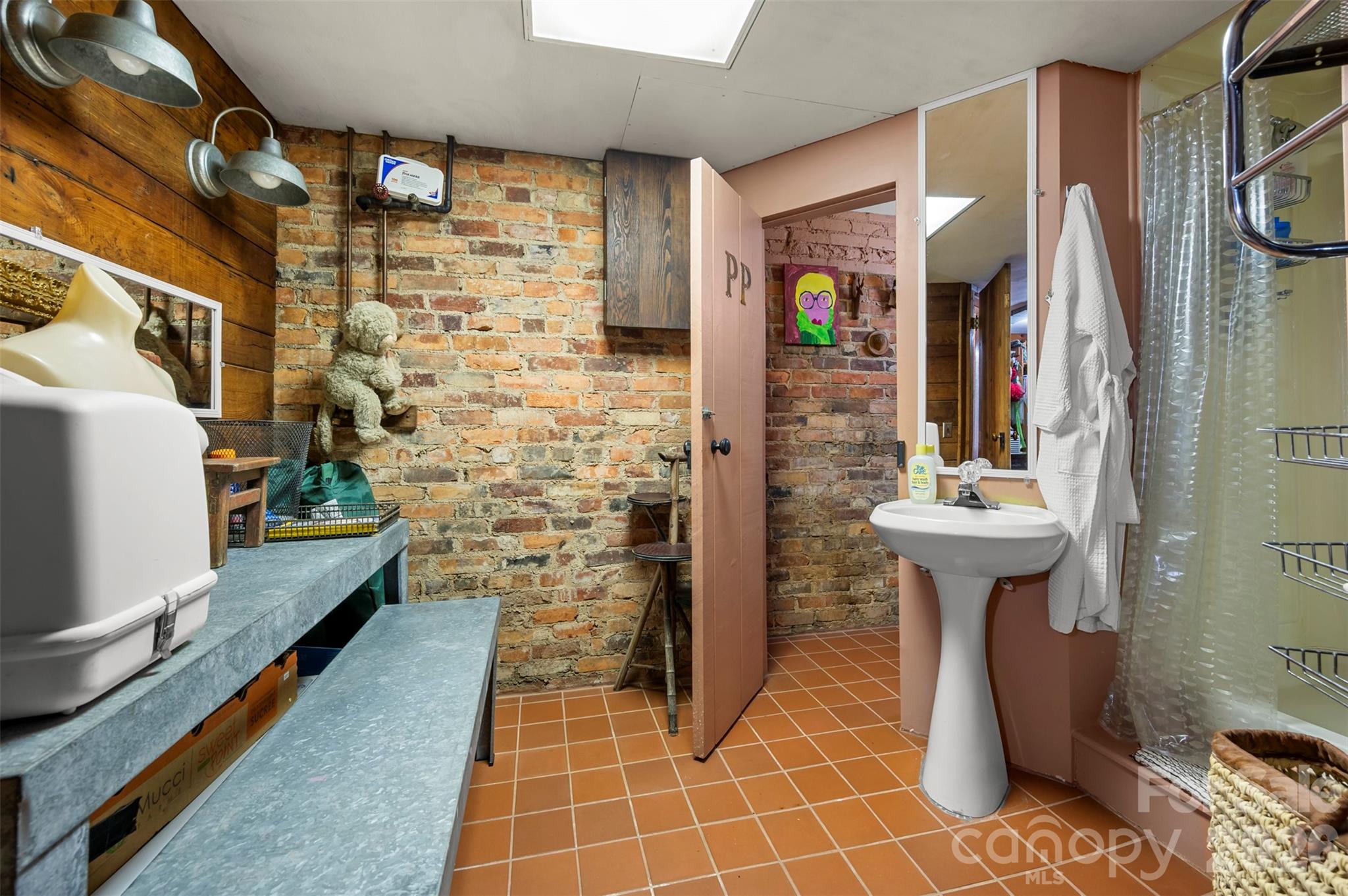 484 Sourwood Ridge Road Tryon, NC 28782 - Photo 26 of 34 a bathroom with a sink a toilet and shower